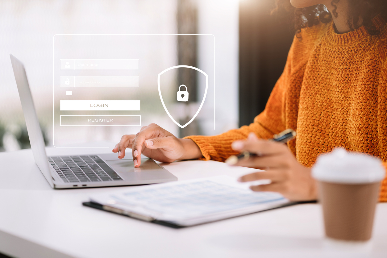 User accessing a secure login interface on a laptop, representing the robust authentication and security features of HCL Notes and HCL Verse within the HCL Domino ecosystem.