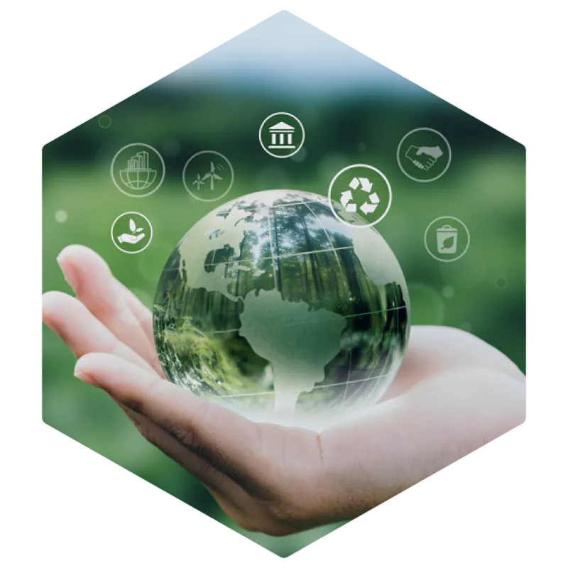 Hand holding a glass globe with sustainability icons, representing environmental responsibility, green energy, and sustainable business practices.